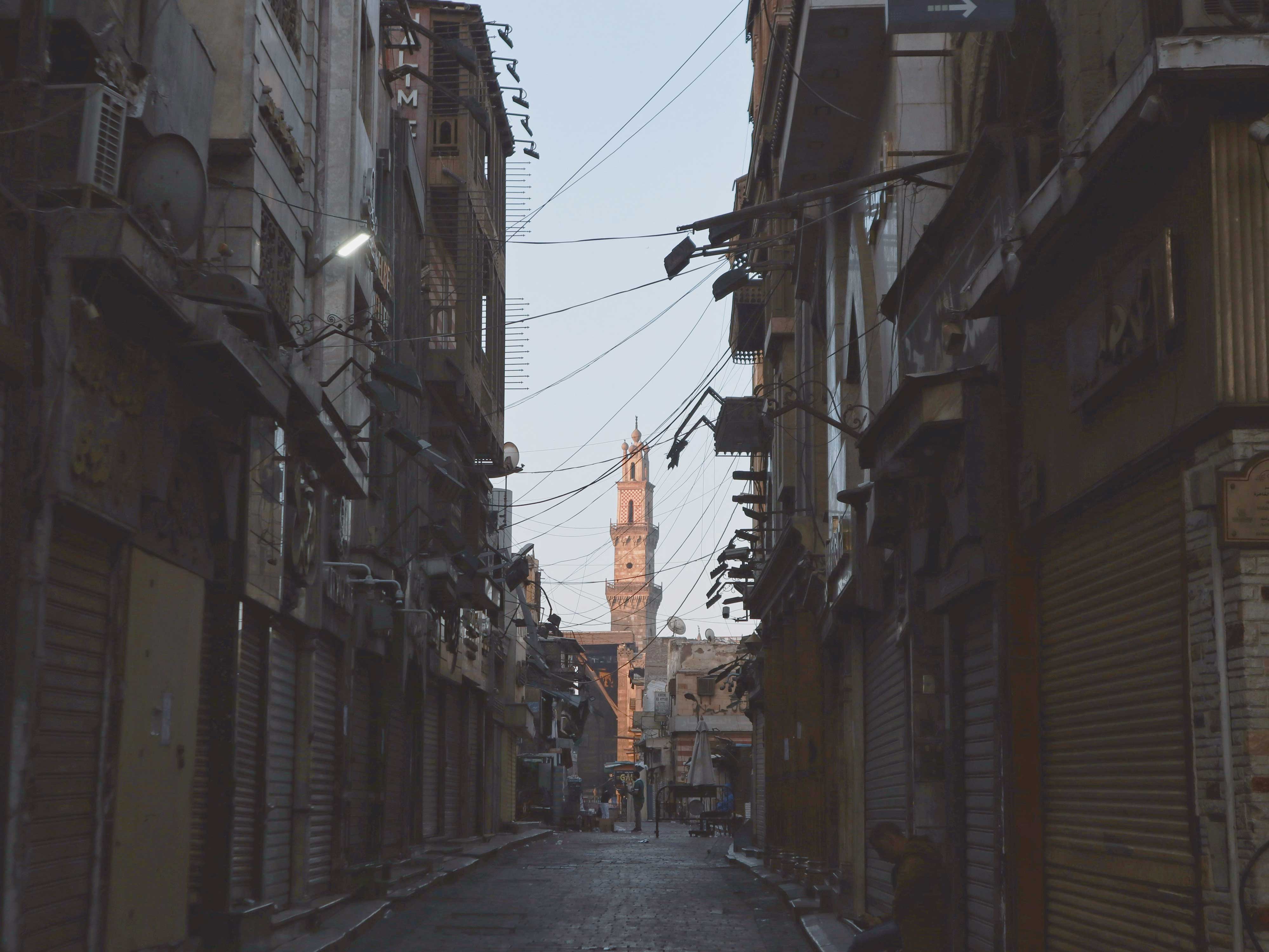 Alley with tower in the distance